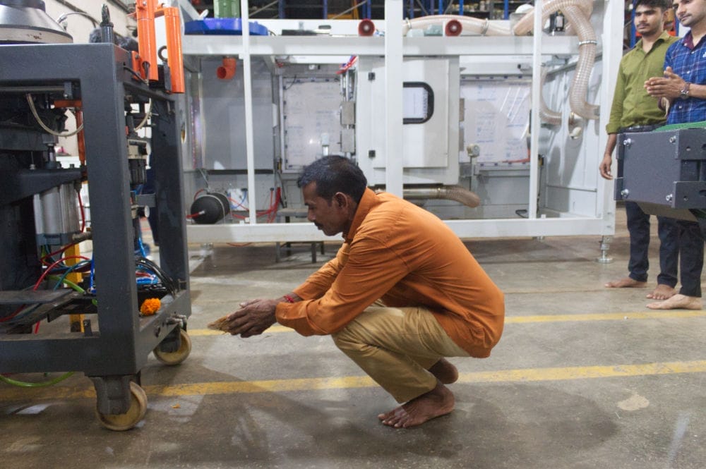 Man performs ritual in industrial setting