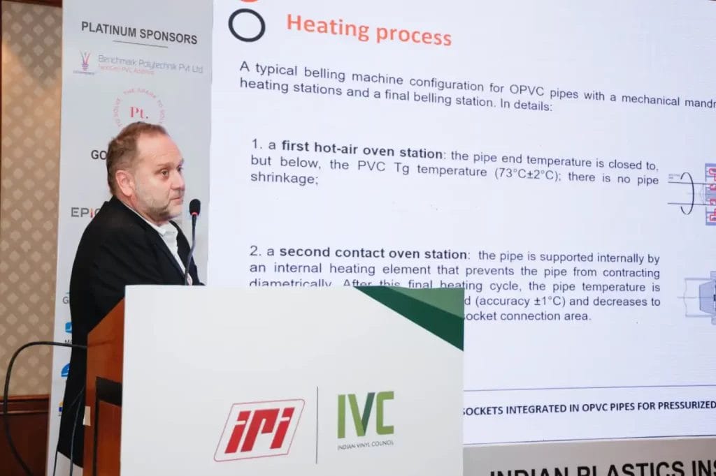 Speaker presenting heating process at conference.